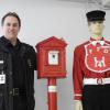 Captain David McKinley and two artefacts from the Fredericton Firefighters Museum