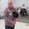 Eric Horncastle of the Fredericton Society of St. Andrew demonstrating the shuttle pipe instrument