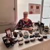 Beth McIntosh with her display of painted rocks.