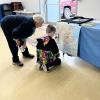 A young visitor looking closely at a display. 