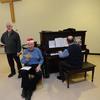 FNHA members Fred White and Dave Neil leading the Christmas sing- a- long at the December 2012 meeting with accompanist Don Stevenson.