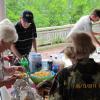 FNHA members and guests enjoying the food provided at the BBQ.